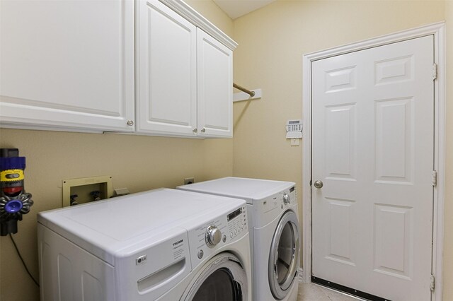 232 Wilshire Dr, Coppell, TX 75019 - clothes washing area featuring light tile patterned flooring, cabinet space, and washer and clothes dryer