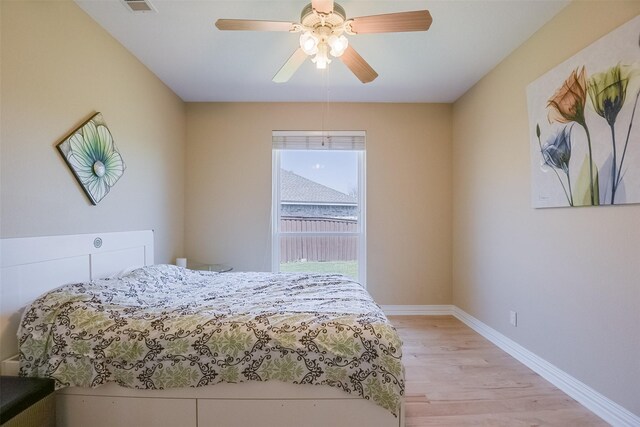 232 Wilshire Dr, Coppell, TX 75019 - bedroom featuring light wood finished floors, baseboards, and a ceiling fan