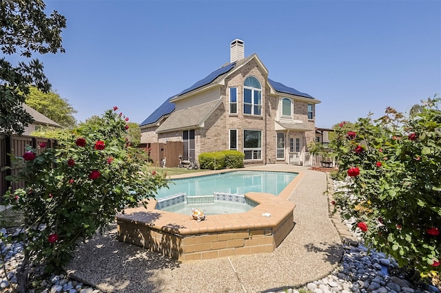 232 Wilshire Dr, Coppell, TX 75019 - view of swimming pool with an in ground hot tub and a fenced backyard