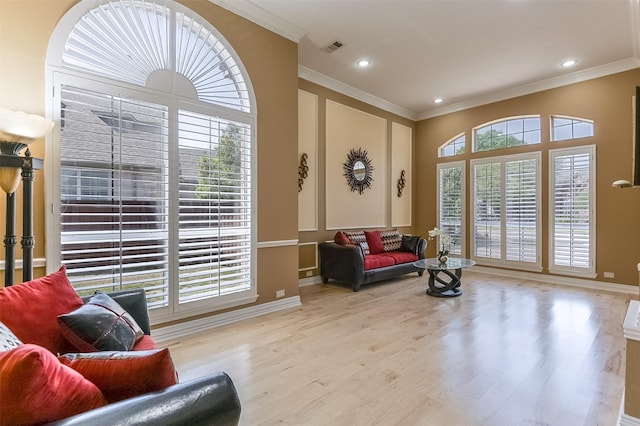 232 Wilshire Dr, Coppell, TX 75019 - living area featuring a healthy amount of sunlight, visible vents, ornamental molding, and wood finished floors