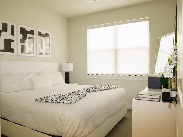 bedroom with dark carpet