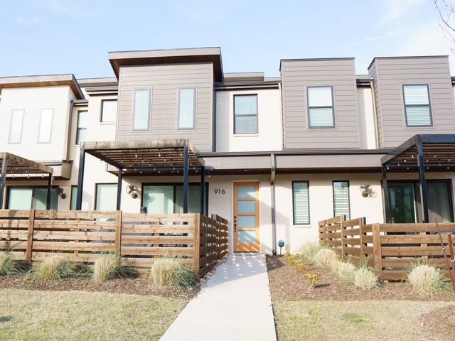 view of front of home featuring fence and stucco siding