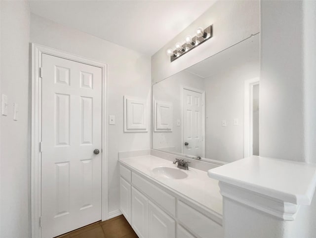 bathroom featuring tile patterned floors and vanity