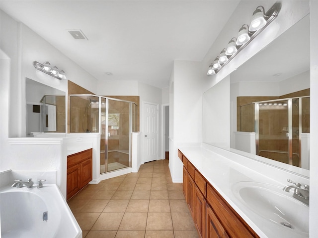 bathroom featuring vanity, tile patterned floors, a shower stall, visible vents, and a bath