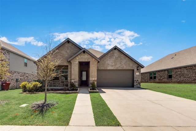 french country inspired facade featuring brick siding, a front yard, driveway, and a garage