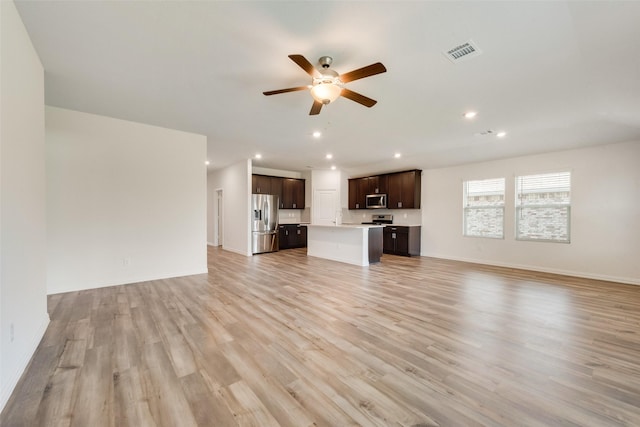 unfurnished living room with recessed lighting, visible vents, light wood finished floors, and ceiling fan