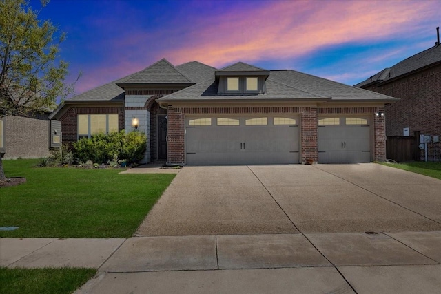 1102 Brigham Dr, Forney, TX 75126 - french provincial home with brick siding, a garage, a lawn, and concrete driveway
