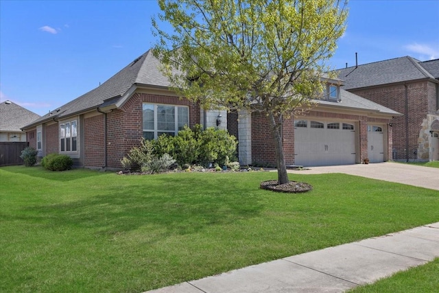 1102 Brigham Dr, Forney, TX 75126 - view of front facade with brick siding, concrete driveway, and a front yard