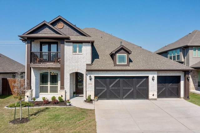 1979 Frediano Ln, Mclendon Chisholm, TX 75032 - french provincial home featuring a garage, a front lawn, a balcony, brick siding, and driveway