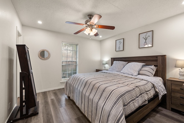 bedroom with a textured ceiling, dark wood-style flooring, baseboards, recessed lighting, and a ceiling fan
