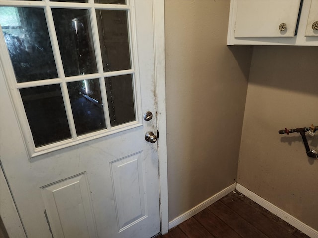 interior space with dark wood-style floors and baseboards