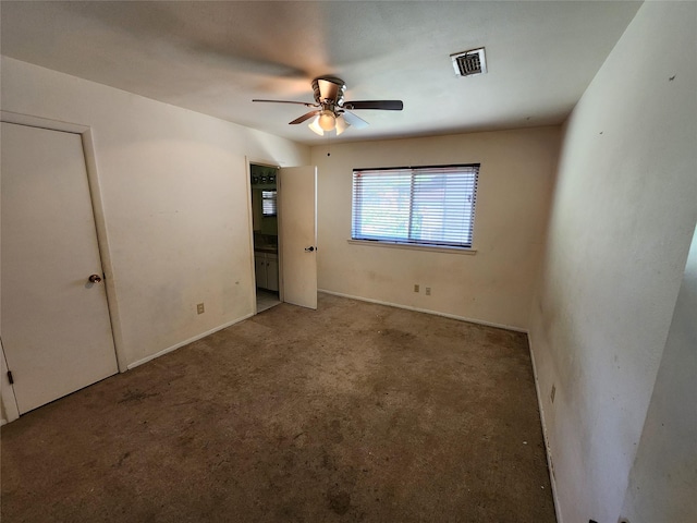 unfurnished bedroom with carpet, visible vents, and ceiling fan