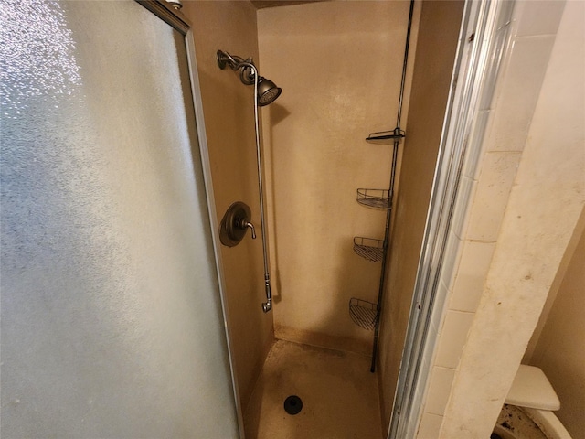 full bath with a shower stall and toilet