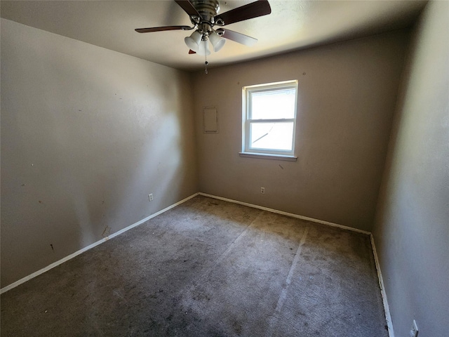 carpeted empty room with baseboards and ceiling fan