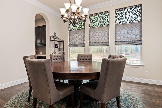 3 Asheville Ln, Trophy Club, TX 76262 - dining area with a chandelier, baseboards, arched walkways, dark wood-style floors, and crown molding
