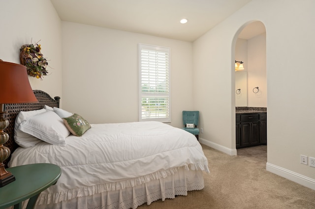 3 Asheville Ln, Trophy Club, TX 76262 - bedroom featuring arched walkways, light colored carpet, baseboards, and ensuite bathroom