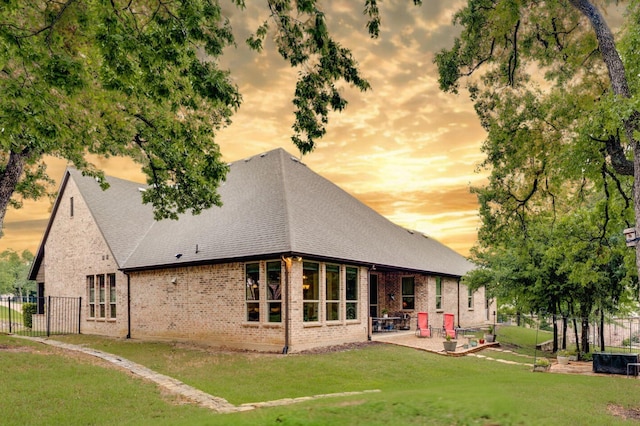 3 Asheville Ln, Trophy Club, TX 76262 - back of property with a patio, brick siding, and a shingled roof