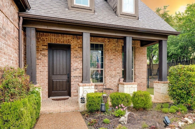 3 Asheville Ln, Trophy Club, TX 76262 - entrance to property featuring brick siding, covered porch, a shingled roof, and fence