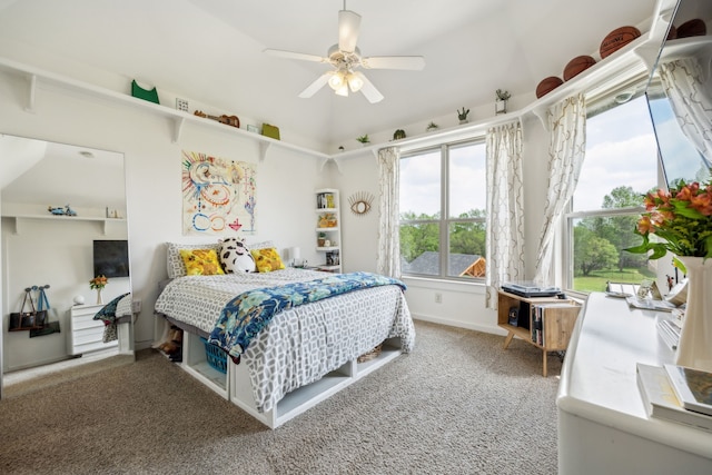 bedroom featuring a ceiling fan, baseboards, carpet, and multiple windows