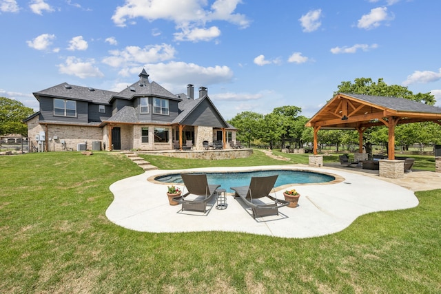 pool featuring a lawn, a gazebo, and a patio area