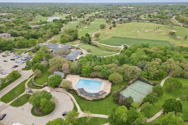 4401 Sorrel Ct, Flower Mound, TX 75028 - drone / aerial view of a golf course, a pool area, and a nearby body of water