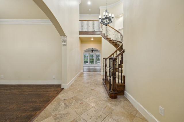 4401 Sorrel Ct, Flower Mound, TX 75028 - entryway with baseboards, crown molding, stairway, stone tile floors, and arched walkways