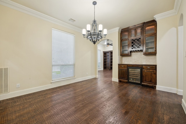 4401 Sorrel Ct, Flower Mound, TX 75028 - indoor dry bar with a chandelier, beverage cooler, decorative light fixtures, ornamental molding, and baseboards
