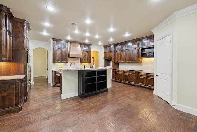 4401 Sorrel Ct, Flower Mound, TX 75028 - kitchen featuring arched walkways, custom exhaust hood, tasteful backsplash, open shelves, and crown molding