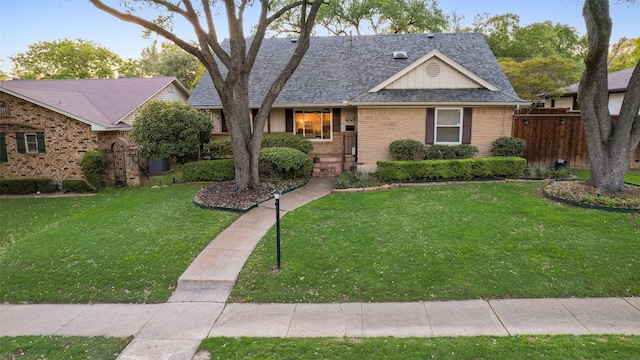 9375 Springwater Dr, Dallas, TX 75228 - view of front facade with brick siding, a shingled roof, board and batten siding, and cooling unit