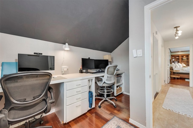 9375 Springwater Dr, Dallas, TX 75228 - office area with light wood-style flooring, vaulted ceiling, and baseboards