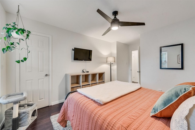 9375 Springwater Dr, Dallas, TX 75228 - bedroom featuring dark wood-type flooring, a ceiling fan, and baseboards