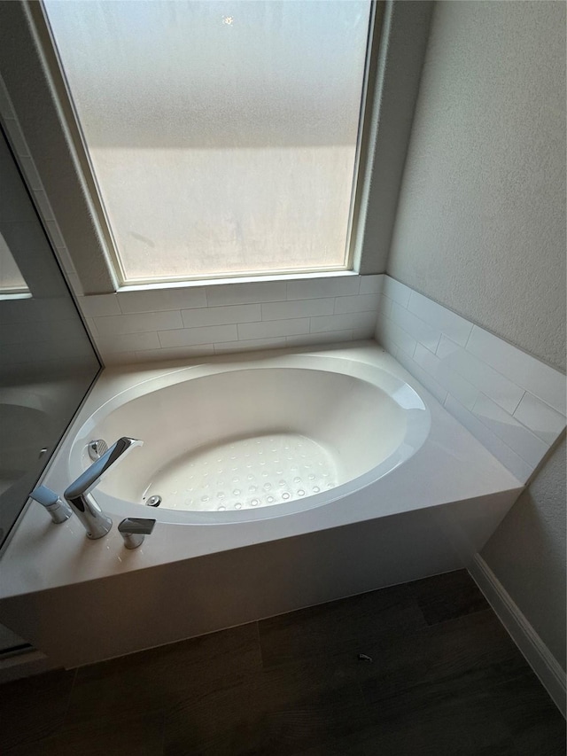 bathroom featuring a bath