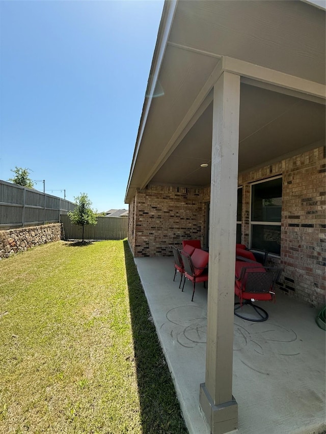 view of yard featuring a fenced backyard and a patio