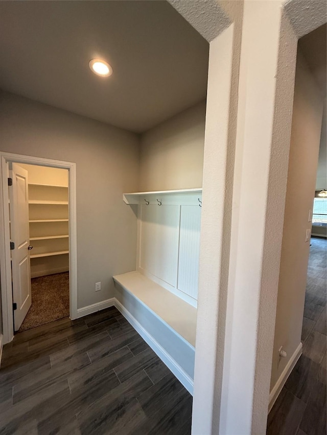 interior space with recessed lighting, dark wood-type flooring, and baseboards