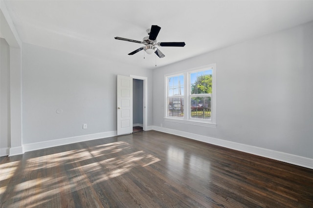 1101 Melbourne Ave, Dallas, TX 75224 - unfurnished bedroom featuring baseboards, a ceiling fan, and dark wood finished floors