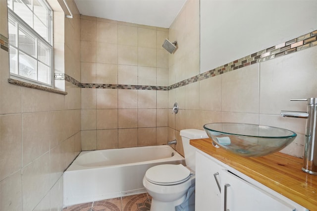 1101 Melbourne Ave, Dallas, TX 75224 - full bathroom featuring toilet, tub / shower combination, vanity, and tile walls