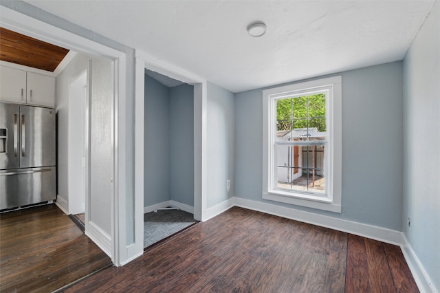 1101 Melbourne Ave, Dallas, TX 75224 - spare room with baseboards and dark wood finished floors