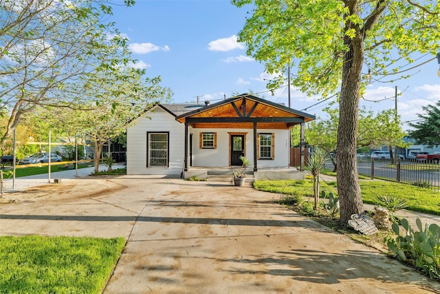 1101 Melbourne Ave, Dallas, TX 75224 - back of house featuring a porch and fence