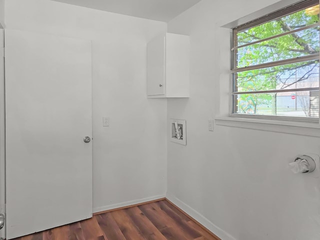 3103 Coggin Ave, Brownwood, TX 76801 - clothes washing area featuring dark wood-type flooring, baseboards, hookup for a washing machine, and cabinet space
