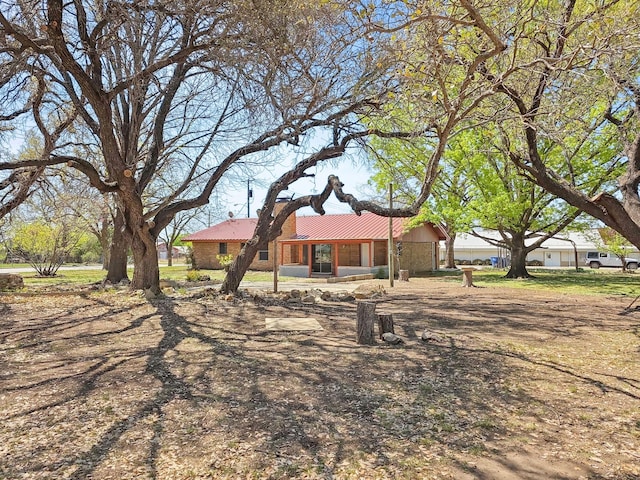 3103 Coggin Ave, Brownwood, TX 76801 - back of property with metal roof