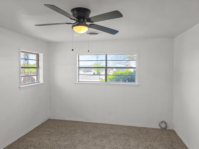 3103 Coggin Ave, Brownwood, TX 76801 - spare room featuring visible vents, ceiling fan, carpet floors, and baseboards