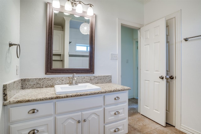 full bathroom with tile patterned flooring, crown molding, and vanity