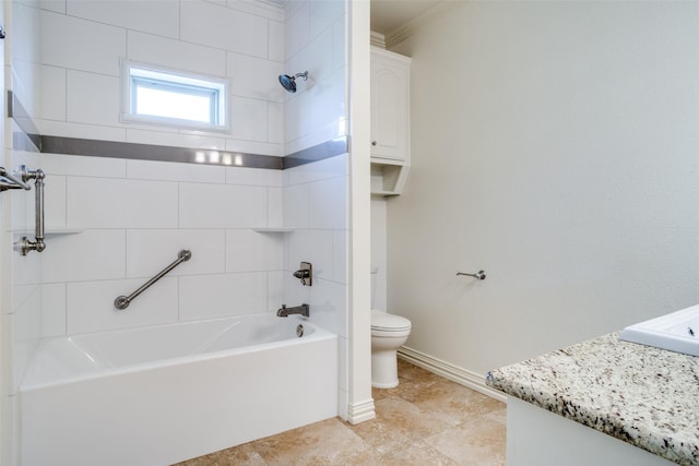 bathroom with ornamental molding, toilet, vanity, baseboards, and tub / shower combination