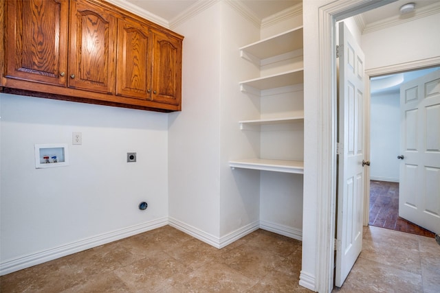 laundry area featuring crown molding, electric dryer hookup, baseboards, hookup for a washing machine, and cabinet space