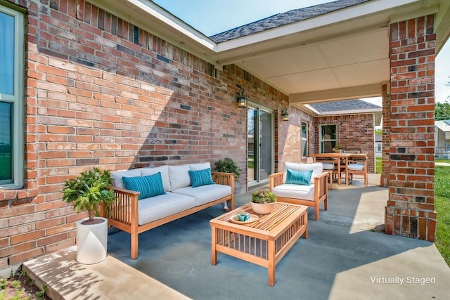 view of patio with an outdoor living space and outdoor dining area