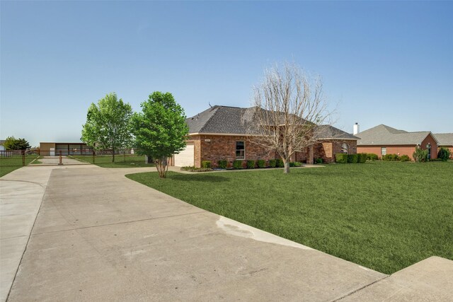 1656 Hearn Ln, Van Alstyne, TX 75495 - view of side of property with brick siding, a shingled roof, and driveway
