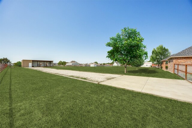 1656 Hearn Ln, Van Alstyne, TX 75495 - view of yard with an outbuilding, gravel driveway, and a detached garage