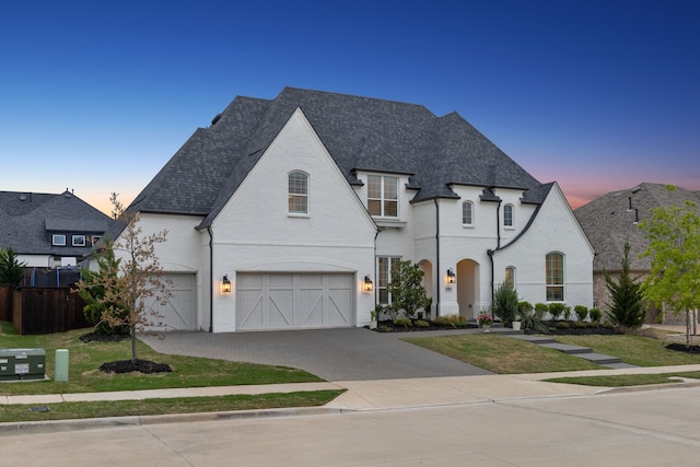2720 Whirlaway Ct, Celina, TX 75009 - french country style house featuring an attached garage, driveway, and brick siding