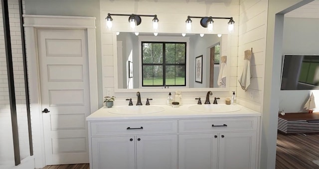 bathroom with a sink and double vanity