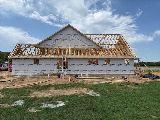 rear view of house with a yard